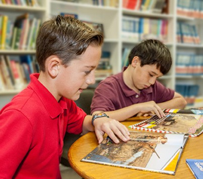MindKCS KCS students reading in the library